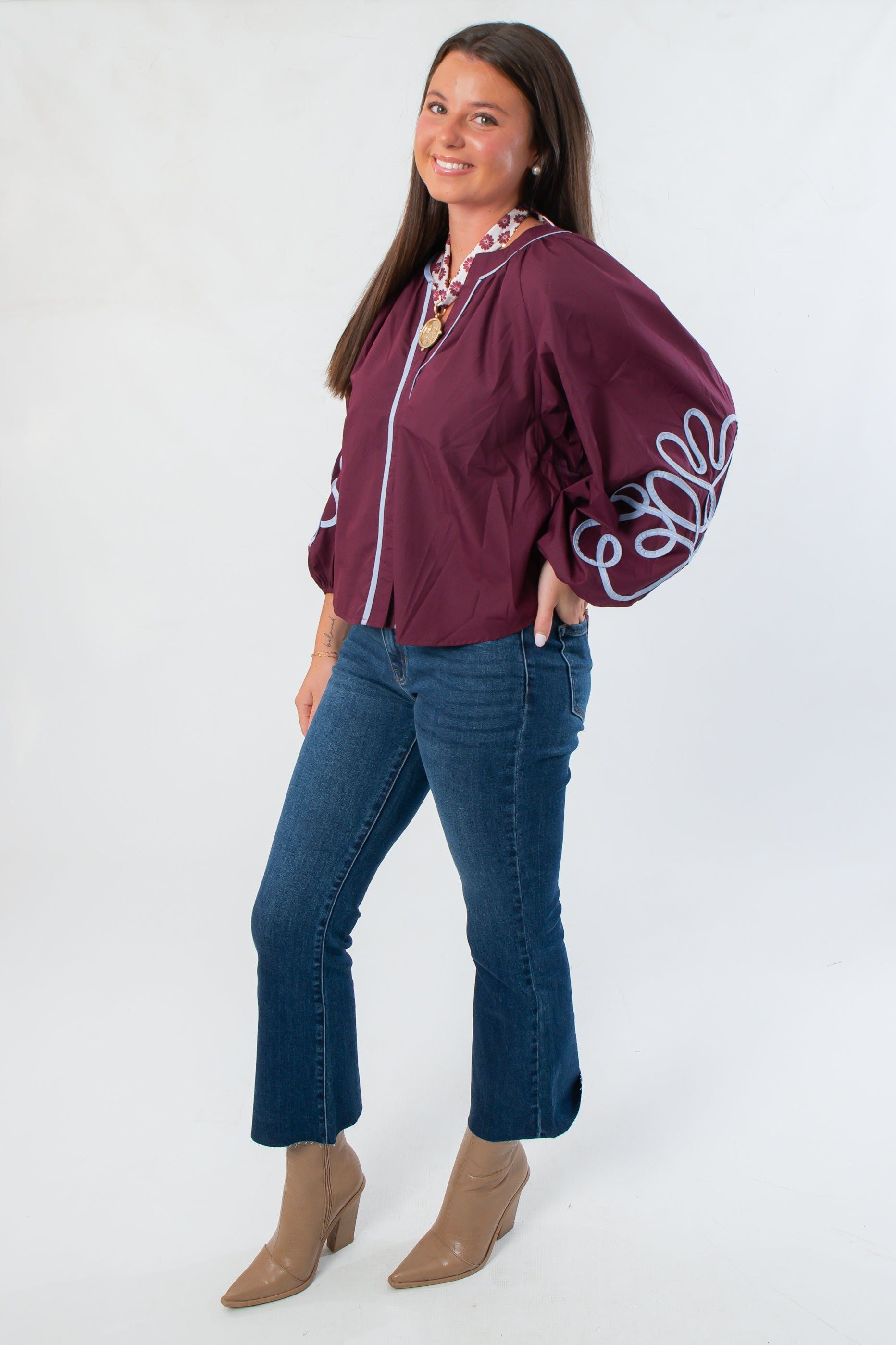 Side view of Glam Wine Long Sleeve Blouse showcasing detailed sleeve embroidery and relaxed fit, ideal for stylish fall outfits.