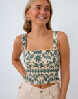 Sleeveless smocked bodice top with cream denim shorts