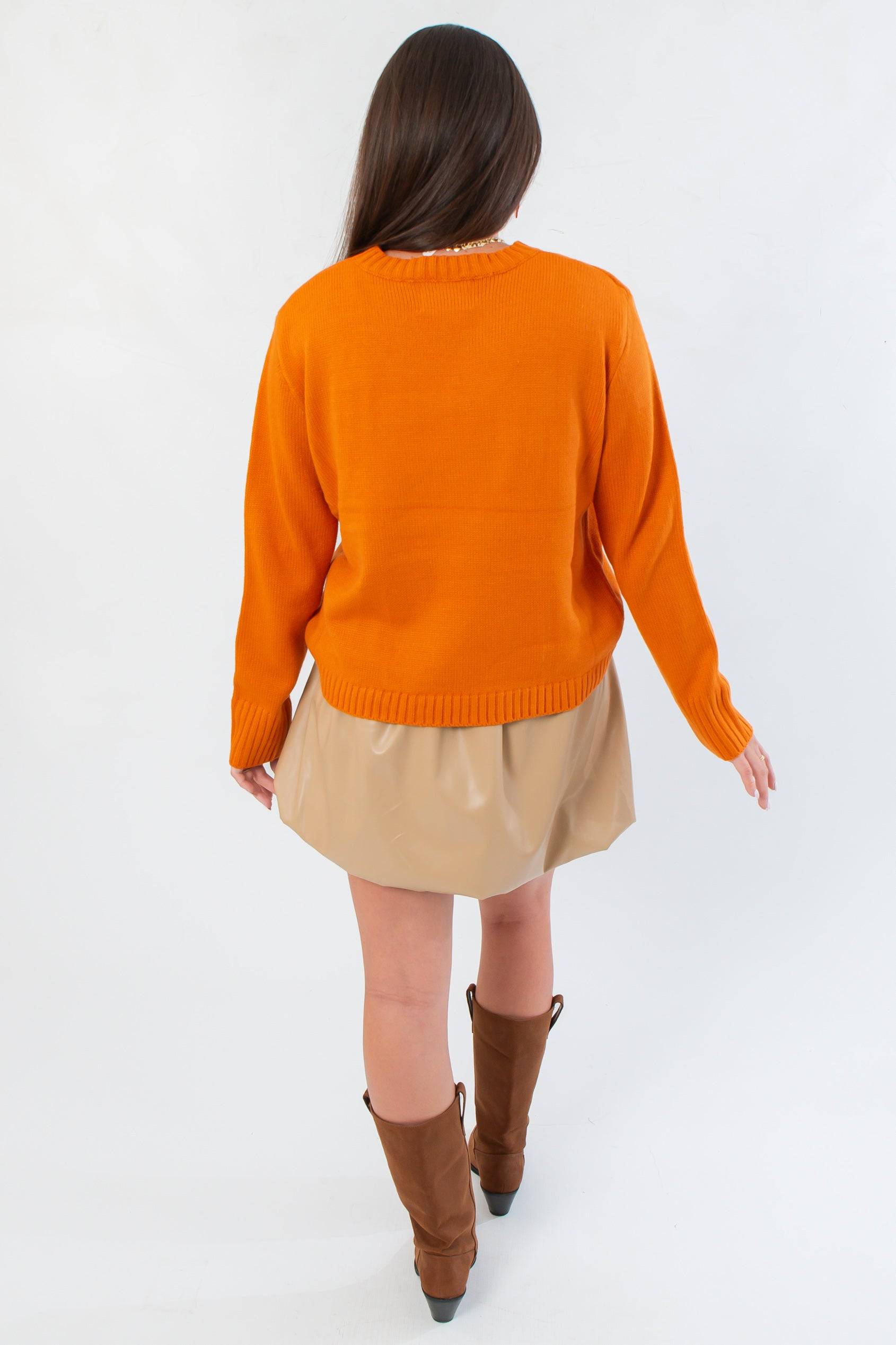 Back view of Game Day Orange Knit Sweater showing relaxed fit and ribbed hem, styled for casual fall layering.
