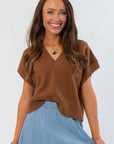 V Neck Sweater - Light Brown Crop Vest with sleeveless design, styled for fall layering. Features ribbed hem and soft knit texture.
