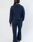 Back view of Spanx Navy AirEssentials Half Zip showcasing its relaxed silhouette and soft, breathable fabric for all-day comfort.