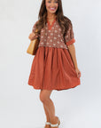 Chateau Chic Rust Embroidered Babydoll Dress with short sleeves and geometric embroidery, styled for fall at L Mae Boutique.
