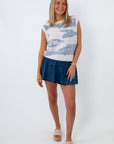 woman wearing sleeveless knit fish sweater with blue fish pattern