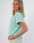 Side view of seafoam ribbed knit short sleeve pocket tee