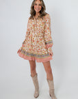 Clyvedon Cream Floral Patterned Mini Dress with long sleeves and floral print, styled with beige cowboy boots
