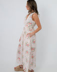 Rear view of Spring Soirée White Floral Midi Dress showing back zipper and floral design