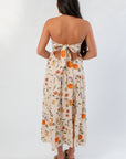 Back view of Heirloom Pumpkin Harvest Strapless Midi Dress with bow tie detail and open back, ideal for stylish fall gatherings.