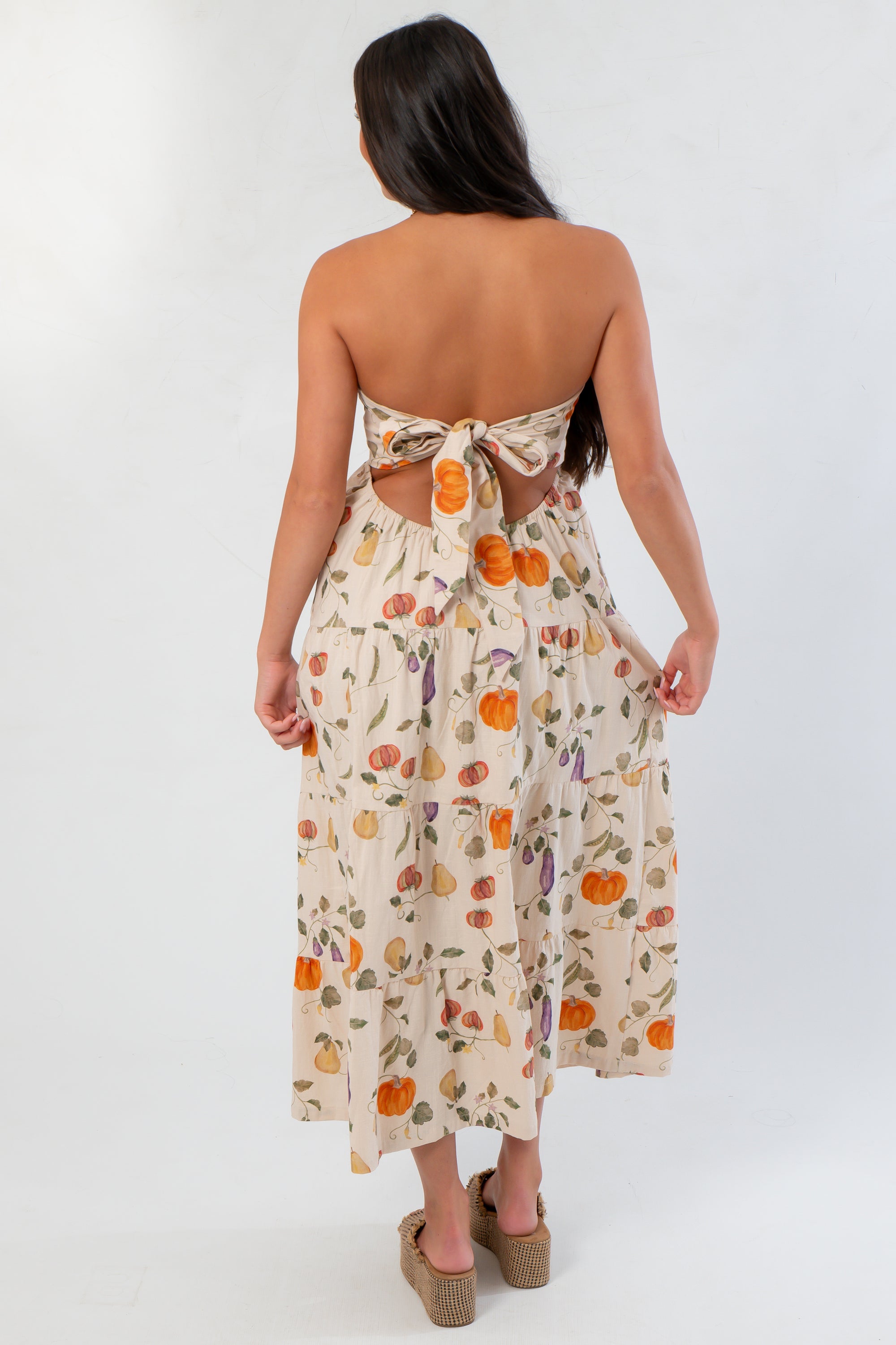 Heirloom Pumpkin Harvest Strapless Midi Dress from behind, showcasing tie-back design and festive pumpkin print for Thanksgiving style.
