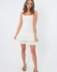 White mini dress with pleated hem for versatile occasions
