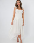 White sleeveless midi dress with ruffled shoulder straps and asymmetrical hem for summer occasions