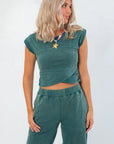 Teal Crop Top - Short Sleeve with wrap front design, styled for casual wear. Soft fabric ideal for women's lounge and fall fashion.