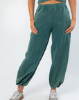 Close-up of Teal Jogger Sweatpants showcasing relaxed fit, side pockets, and soft fabric ideal for lounging or casual outings.