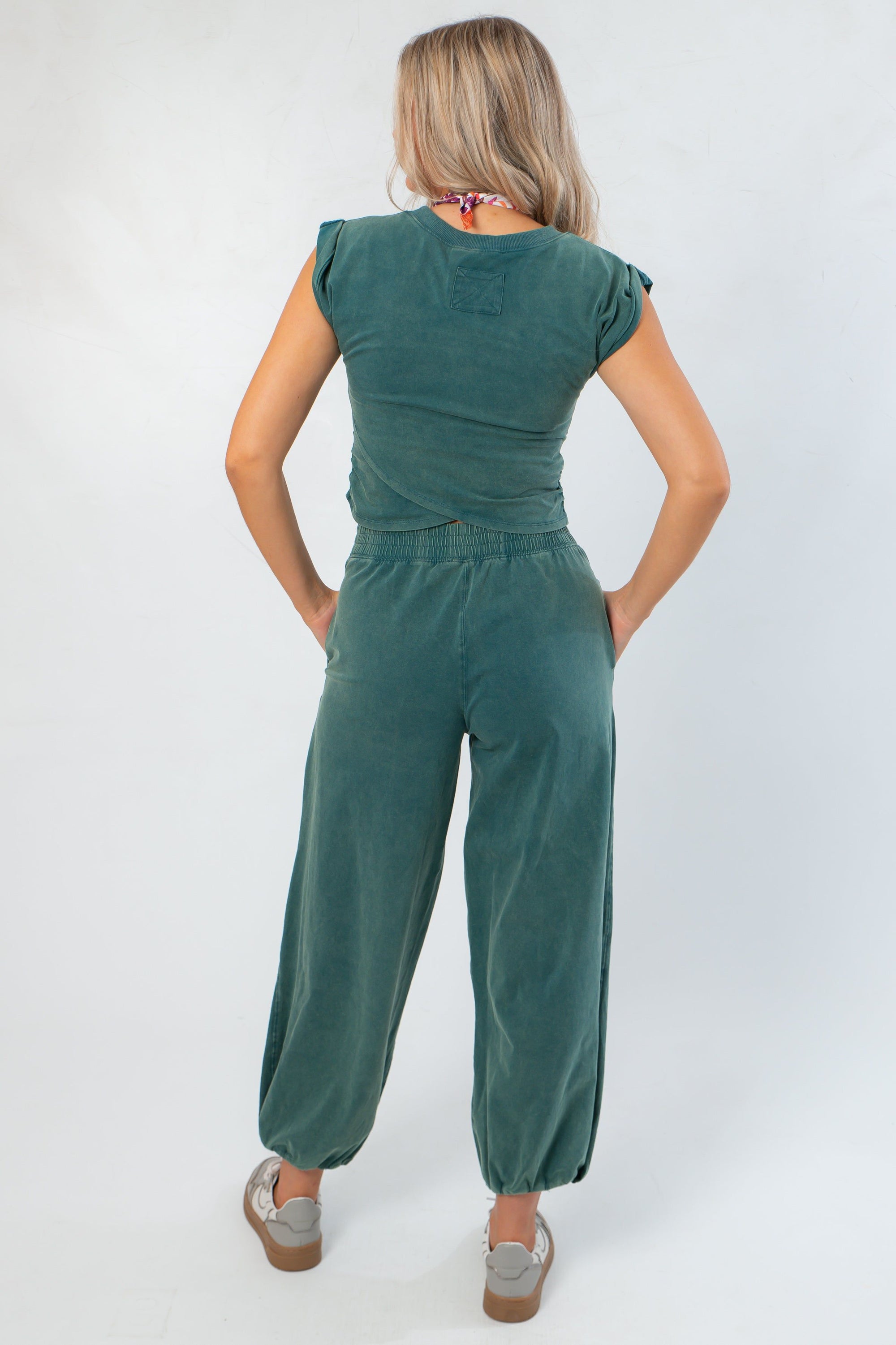 Back view of Teal Short Sleeve Crop Top with relaxed fit, styled with matching pants for a coordinated lounge outfit.
