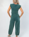 Back view of Teal Short Sleeve Crop Top with relaxed fit, styled with matching pants for a coordinated lounge outfit.