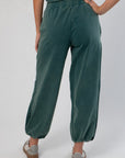 Back detail of Teal Jogger Sweatpants featuring elastic waistband and gathered ankle cuffs for a snug, stylish fit.