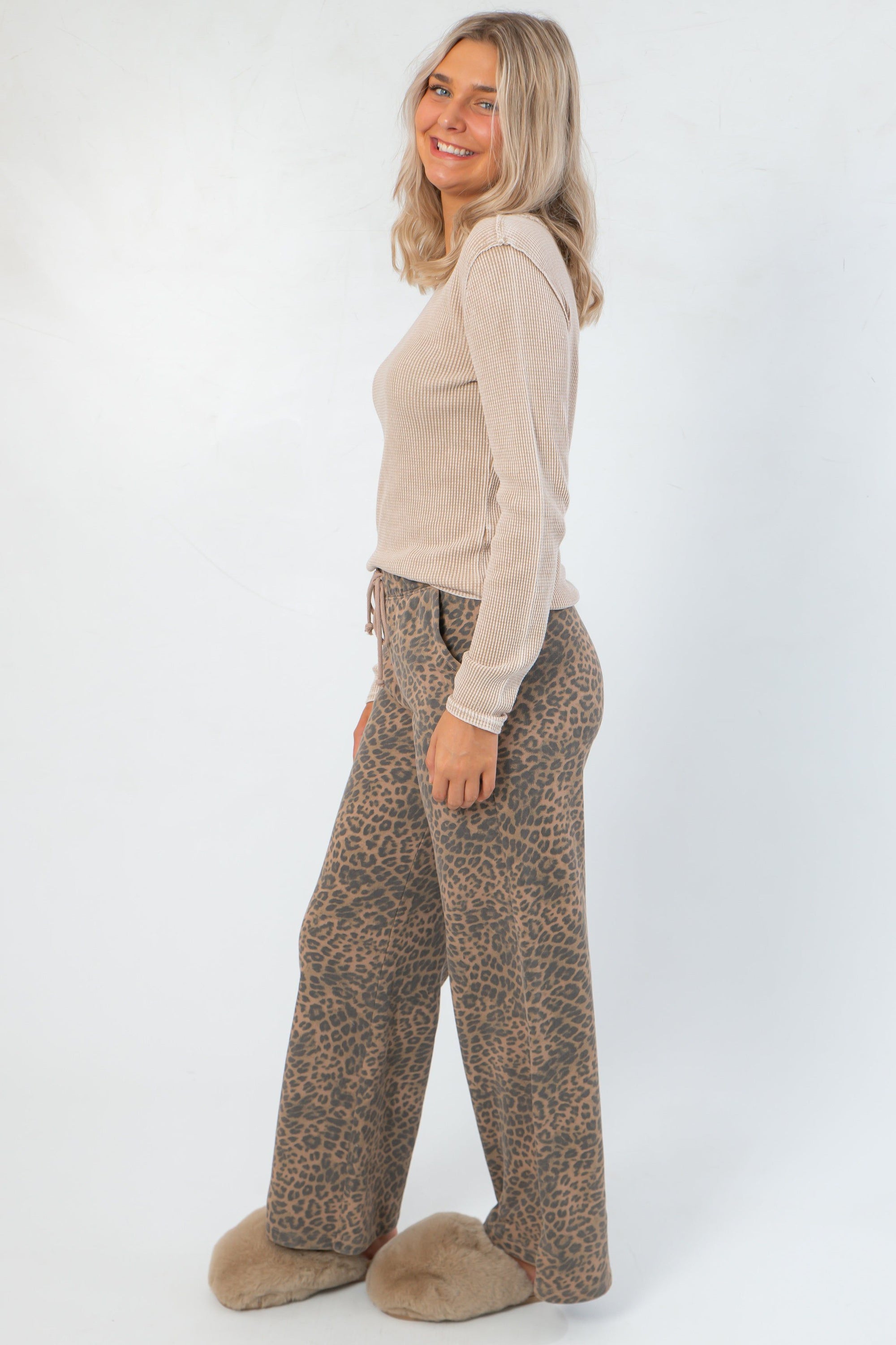 Side profile of Z Supply Desert Tan Arlet Mini Thermal Top showing its slim fit and ribbed texture, styled with relaxed leopard print pants.