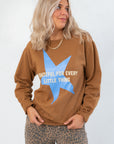 Thankful Cozy Knit Grateful for Everything Graphic Star Sweatshirt featuring bold blue star and white lettering, perfect for fall and Thanksgiving.