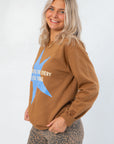 Side view of Grateful for Everything Graphic Star Sweatshirt with relaxed fit and bold graphic, styled for casual fall and lounge wear.