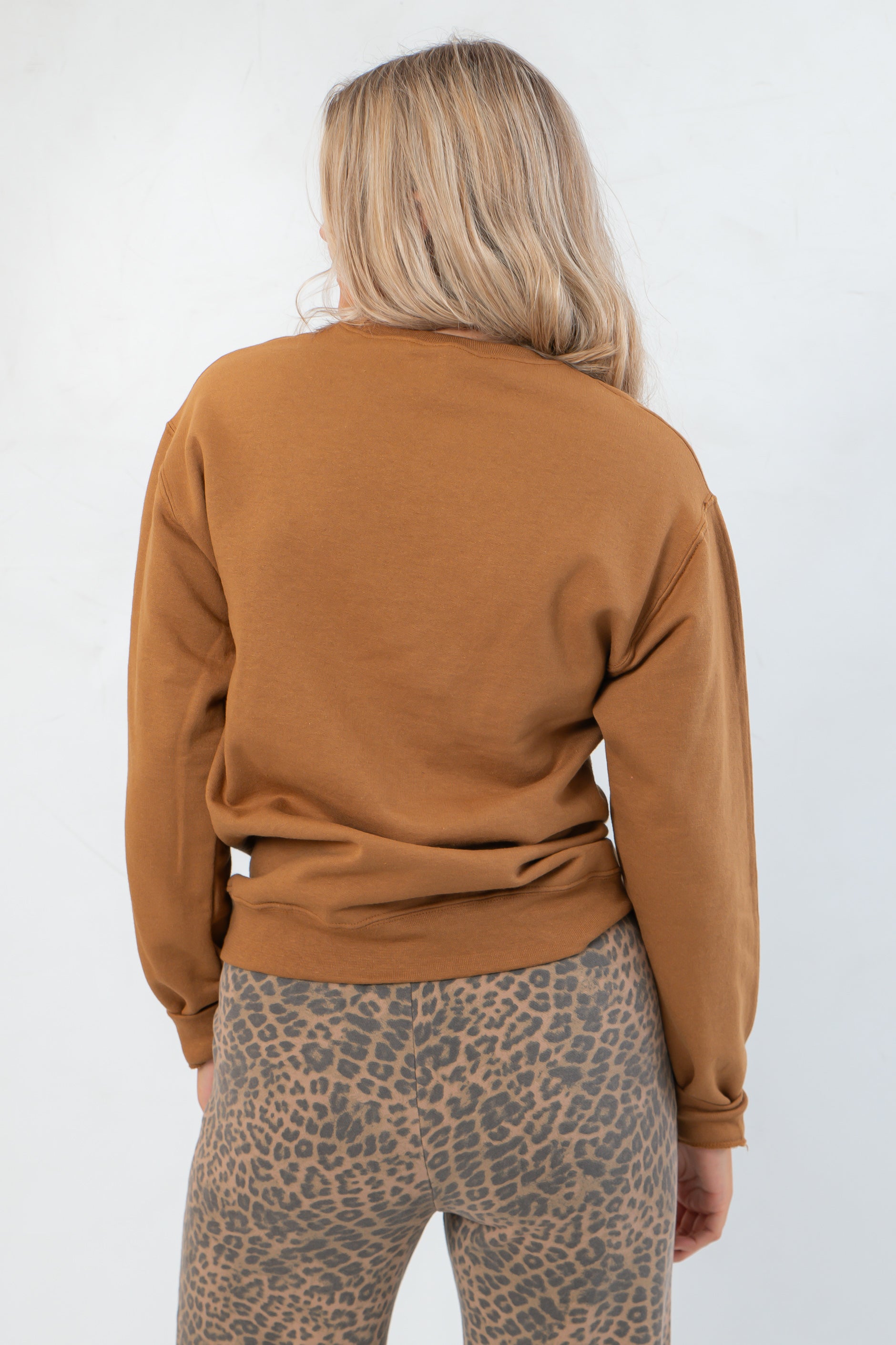 Back view of brown Grateful for Everything Graphic Star Sweatshirt showing solid color and soft knit texture, perfect for layering in fall.