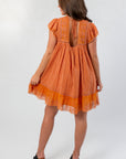 Back view of Amber Romance Lace Babydoll Dress featuring lace paneling and keyhole tie detail for a romantic finish.