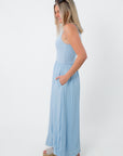 Side view of light blue sleeveless maxi dress with pockets, casual summer style