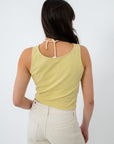 Back view of yellow sleeveless top with tie detail