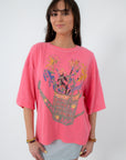 Women wearing pink graphic boho T-shirt with floral print, casual spring top