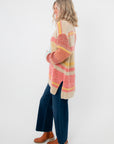 Side view of Iris Orange Stripe Open Cardigan – Cozy oversized fit with bold orange, yellow, and beige stripes, perfect for spring layering.