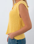 Back view of yellow sleeveless slub knit sweater for women