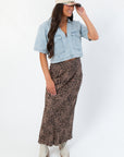 Chic fall look featuring Delilah Denim Short Sleeve Woven Top paired with animal print skirt and ankle boots, ideal for layered autumn outfits.