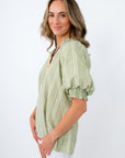 green plaid top with white shorts