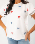 THML Red & Blue Bow Embroidery Top featuring puff sleeves and patriotic bow accents, perfect for Memorial Day or July 4th celebrations.