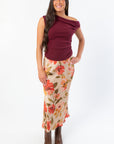 Wildflower Waltz Floral Printed Midi Slip Skirt by Wild Mabel Clothing featuring a vintage-inspired fall floral print in warm tones. Styled with a burgundy top and brown boots for a chic seasonal look.