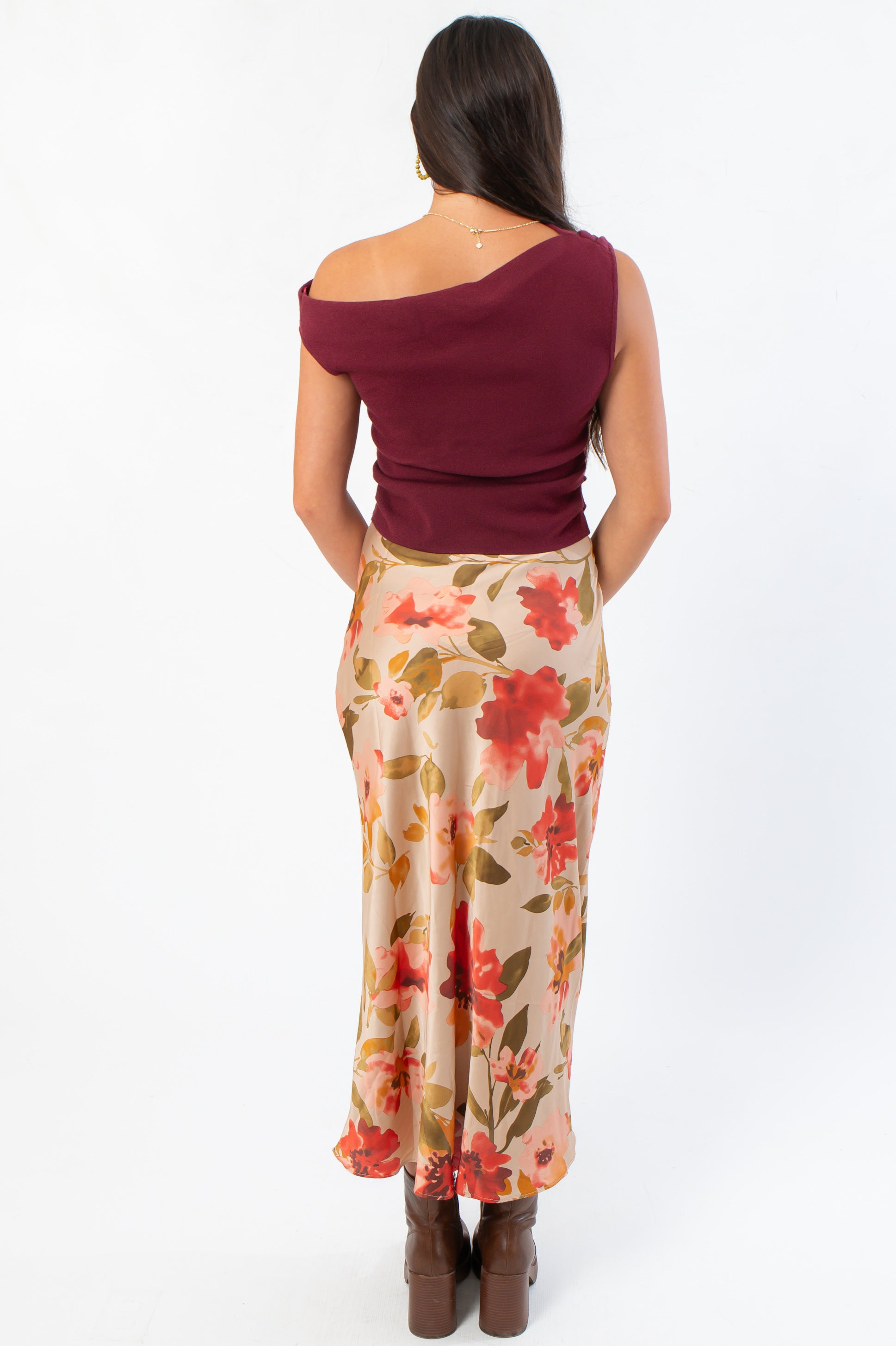 Back view of Wildflower Waltz Floral Printed Midi Slip Skirt - Wild Mabel Clothing, featuring a beige base with red and green floral print, styled for fall fashion.