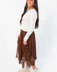 Side view of Serene Mocha Lace Maxi Skirt showcasing its flowy, layered lace design in a chic mocha tone.