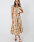 Women wearing a floral midi dress with ruffled sleeves and a tie waist, perfect for summer events