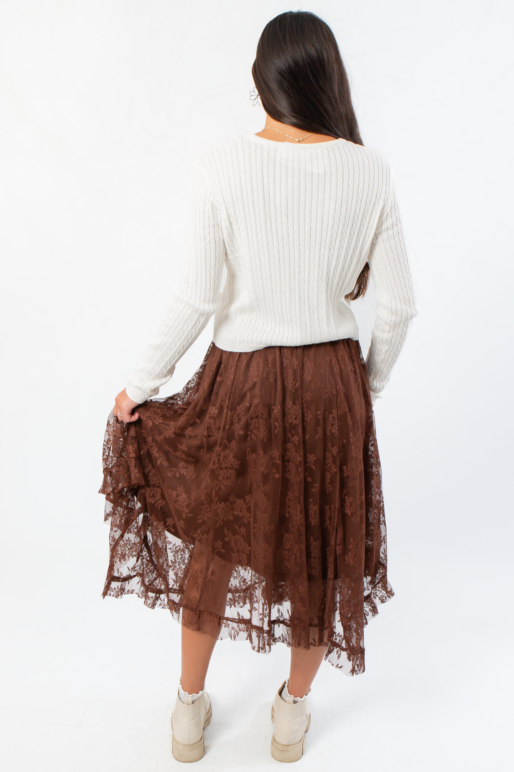 Back view of Serene Mocha Lace Maxi Skirt highlighting its sheer lace texture and elegant ruffle detailing.