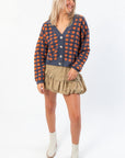 Blue Ridge Plaid Checkered Cardigan styled with neutral skirt and boots, highlighting its cozy fit and fall-ready design.