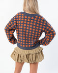 Back view of Blue Ridge Plaid Checkered Cardigan showing navy and orange plaid knit design, ideal for cozy fall outfits.