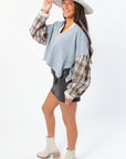 Side view of Everyday Ease Patchwork Denim Top showing flowy silhouette and plaid sleeve detail, ideal for cozy fall layering.