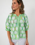 Back view of green gingham sequin blouse with colorful embroidery for women