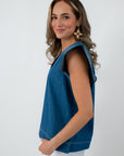 Side view of denim twill blue short sleeve blouse with contrast stitching, women's fashion top