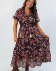 Front view of THML Burgundy Printed Puff Sleeve Tiered Maxi Dress featuring tiered skirt and puff sleeves, ideal for casual fall occasions.