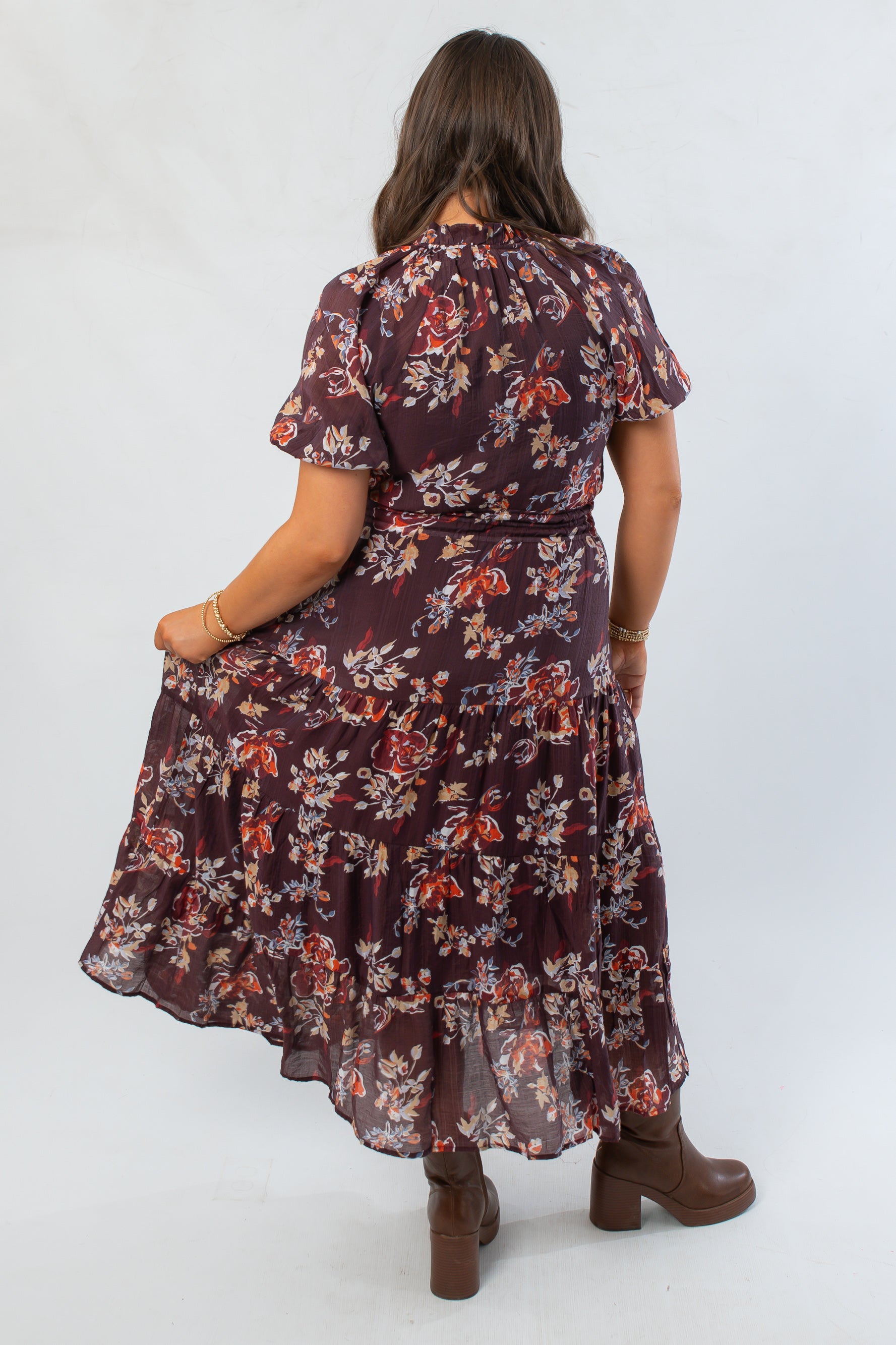 Back view of THML Burgundy Printed Puff Sleeve Tiered Maxi Dress highlighting floral design and tiered hem, great for seasonal wardrobes.