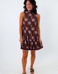 Brown sleeveless mini dress with purple floral block print, floral mini dress with high neckline and tie back