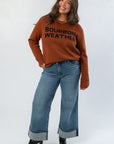 Cozy Bourbon Weather Intarsia Knit Sweater styled with wide-leg jeans and black boots, ideal for stylish cold-weather outfits.