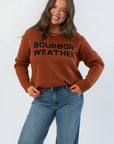 Bourbon Weather Intarsia Knit Sweater in warm brown with bold black lettering, perfect cozy top for fall and winter layering.