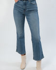 Daze Denim Rush Hour Soho High Rise Ankle Flare jeans in medium wash with flared hem and high-rise fit, styled with cream ankle boots.