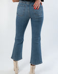 Back view of Daze Denim Rush Hour Soho High Rise Ankle Flare jeans highlighting rear pockets, high waist, and flared ankle fit.