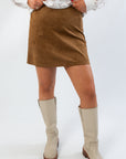 Z Supply Coconut Ciera Suede Mini Skirt in rich brown suede with a flattering A-line cut, styled with cream knee-high boots for fall fashion.